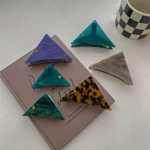 Minimalist triangular acetate claw clips in 6 assorted marble colors for elegant hair styling