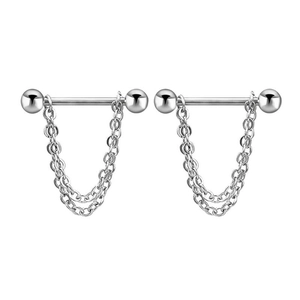 Macro detail of silver barbell nipple rings featuring double delicate hanging chains