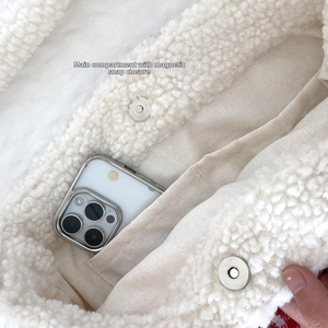 Detail of plush bag interior featuring magnetic snap closure and inner slip pocket