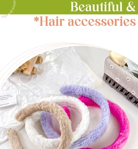 Detailed macro view of plush faux fur headbands in beige, white, purple, and rose colors