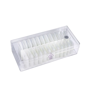 Clear plastic box containing matte white false nail tips in small sizes 5-9 on white back