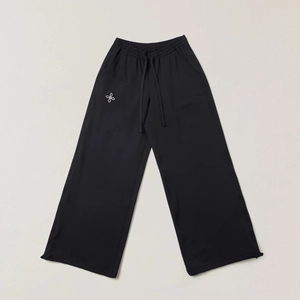 Black wide-leg cargo pants with white floral logo and adjustable drawstring waistband