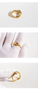 Detailed macro view of irregular gold lava texture ring with a square zircon gemstone