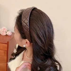 Deep brown quilted faux leather padded headband featuring classic diamond stitching for women