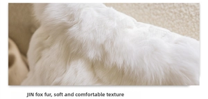 Macro detail of luxury white fox fur pillow cover showing soft premium plush texture