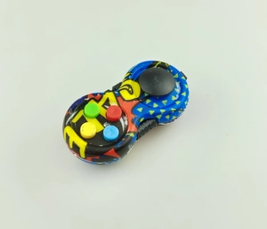 Close-up of portable fidget controller toy with colorful silicone buttons and plastic grip