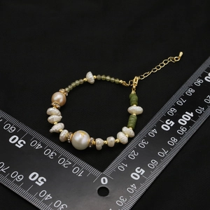 Natural freshwater pearl and green stone bracelet with 18k gold plating and crystals