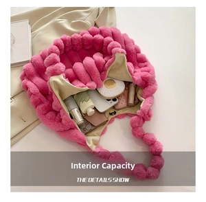 Detail showing inner capacity of pink plush tote bag with phone and cosmetics