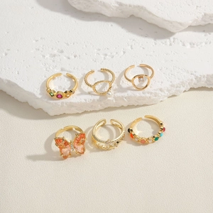 6-piece gold ring set featuring a large butterfly, pearls, and colorful zircon accents