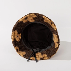 Leopard print faux lamb wool bucket hat with plush texture and adjustable inner drawstring