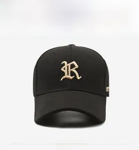 Close-up of premium black canvas baseball cap featuring gold embroidered letter R