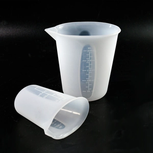 Detail showing two 250ml flexible silicone measuring cups with clear scale and spout
