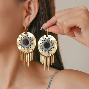 Bohemian gold round earrings with grey woven cord inlay and hanging metal tassels