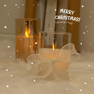 LED Christmas candle lights with white bows on cozy faux fur rug, festive holiday decor