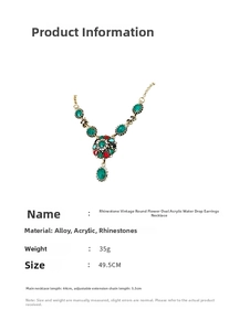 Detailed view of a vintage rhinestone necklace with dimensions and green acrylic gems