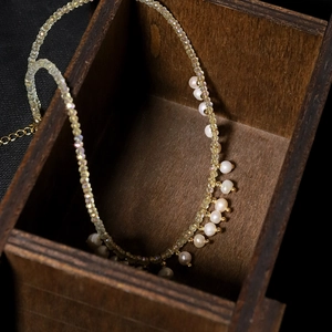 Elegant natural pearl necklace with yellow crystal beads in a vintage wooden gift box