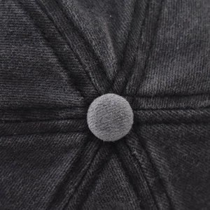 Macro detail of high-density cotton twill fabric crown and top button on baseball cap