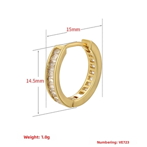 Detail view of gold hoop earrings with baguette zircons, size 15mm by 14.5mm