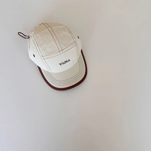 Detailed close-up of 5-panel canvas baseball cap with YIJIA logo and contrast stitching