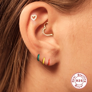 S925 sterling silver heart earrings with colorful enamel hoops worn on ear