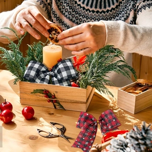 Classic checkered Christmas bows on a rustic wooden table for festive holiday decoration