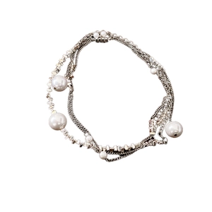 Elegant multi-layer silver necklace with metallic fragments and lustrous white pearls