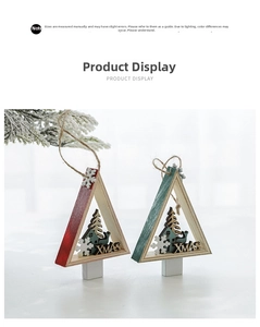 Detail of red and green wooden triangle Christmas ornaments with XMAS laser cutouts