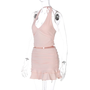 Detail of pink V-neck halter top and ruched mini skirt set with ruffled hem finish