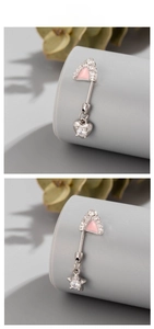 Detail of titanium ear studs featuring pink triangles with heart and star charms