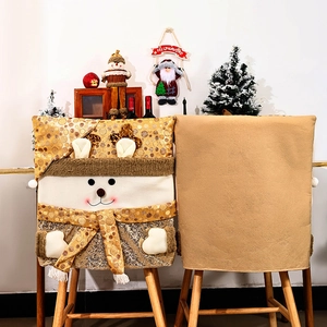 Christmas chair covers with gold sequins and snowman elk motifs for festive dining decor