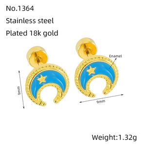 Detail of 18K gold plated stainless steel star and moon studs with blue enamel