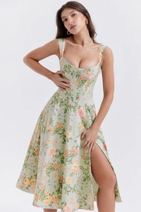 Detail of floral slit dress featuring boned waist structure and square neckline