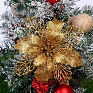 Glittering orange poinsettia flower ornament for Christmas tree and wreath decoration