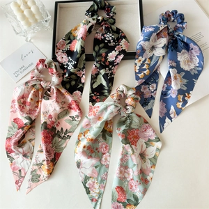 Set of four satin print scarf scrunchies with long ribbons in assorted floral patterns