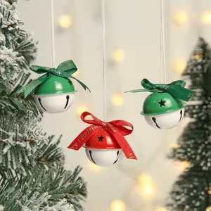 Three Christmas tree bells in red and green with star cutouts and festive bows
