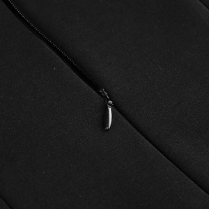 Detailed macro view of the invisible zipper closure on the black solid party dress fabric