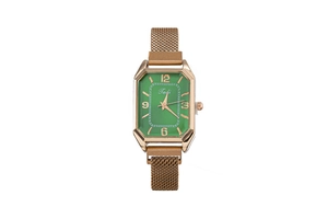 Detail of a square green watch face with rose gold numerals and Milanese mesh strap