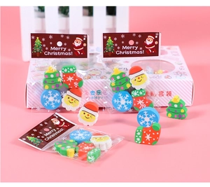 Close-up of colorful Christmas eraser set with Santa, tree and snowflake shapes