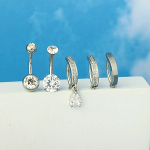 Five-piece set of silver stainless steel belly button rings with zircon stones and dangles