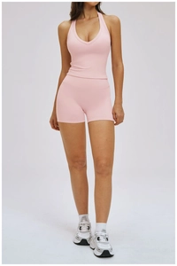 Pink yoga set featuring a V-neck slim-fit tank top and high-waist sports shorts for women