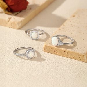 Three elegant S925 sterling silver rings with synthetic opal stones and side diamonds