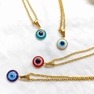 Elegant gold evil eye necklaces with colorful round pendants in blue, white, and red charms