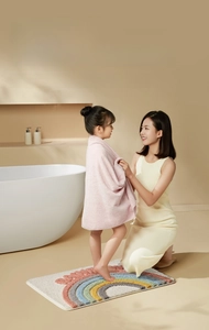 Absorbent rainbow bathroom mat with non-slip texture for safe family home use
