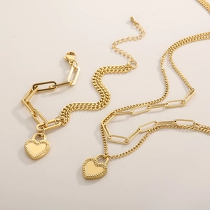 Golden double-layer paperclip and Cuban chain jewelry set with heart lock pendant
