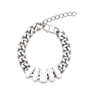 Polished silver Cuban link bracelet with five rectangular bars and lobster clasp detail