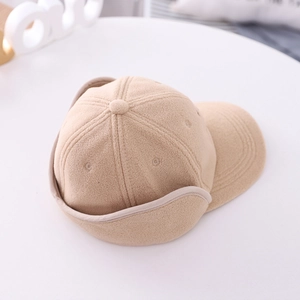 Detail view of khaki polar fleece winter hat with earflaps and baseball cap brim
