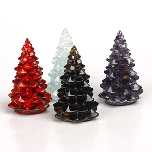 Four elegant crystal resin Christmas tree figurines in red, green, brown and purple hues