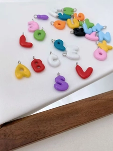 Colorful enamel letter charms for DIY jewelry making, alphabet pendants for bracelets and necklaces.