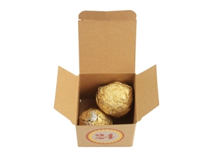 Detailed view of brown kraft paper advent box numbered 24 with golden chocolates inside
