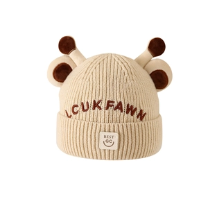 Warm knit winter hat for children featuring cute cartoon giraffe antlers in beige color